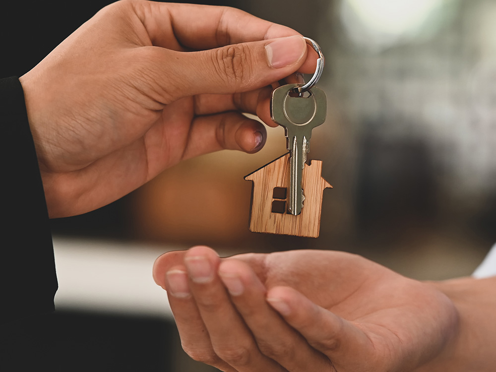Landlord handing tenant keys