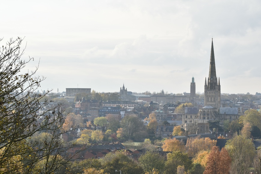 Views of houses, trees, buildings and cathedral in Norwich, Norfolk from Mousehold Heath.