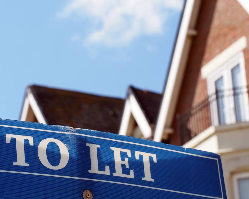 To Let estate agent sign in front of residential property