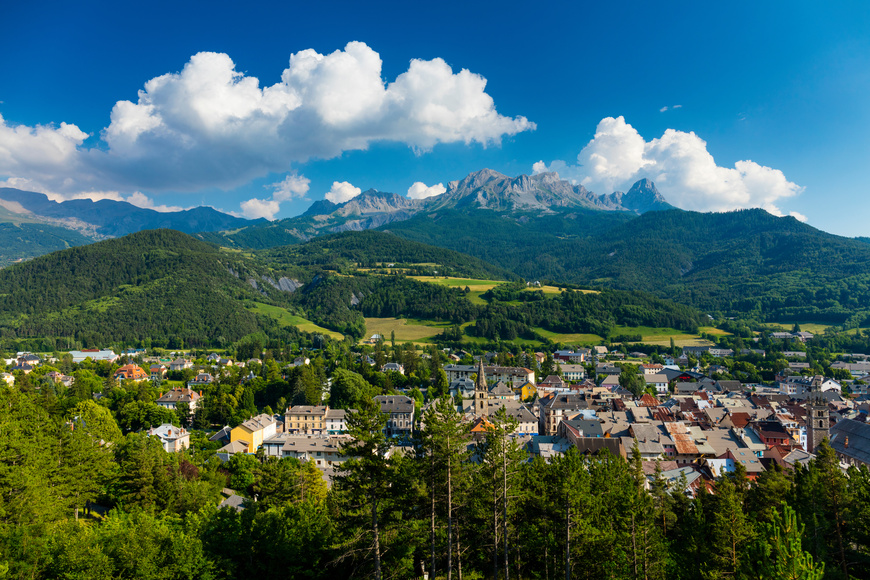 View of the alps and houses in Barcelonnette Town, Ubaye Valley, Vallée de l'Ubaye, Alpes Haute Provence, French Alps