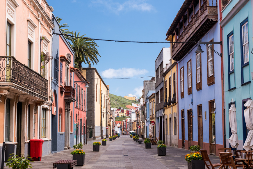 Paved street view of a colourful row of houses in La Laguna, Tenerife, Canary Islands